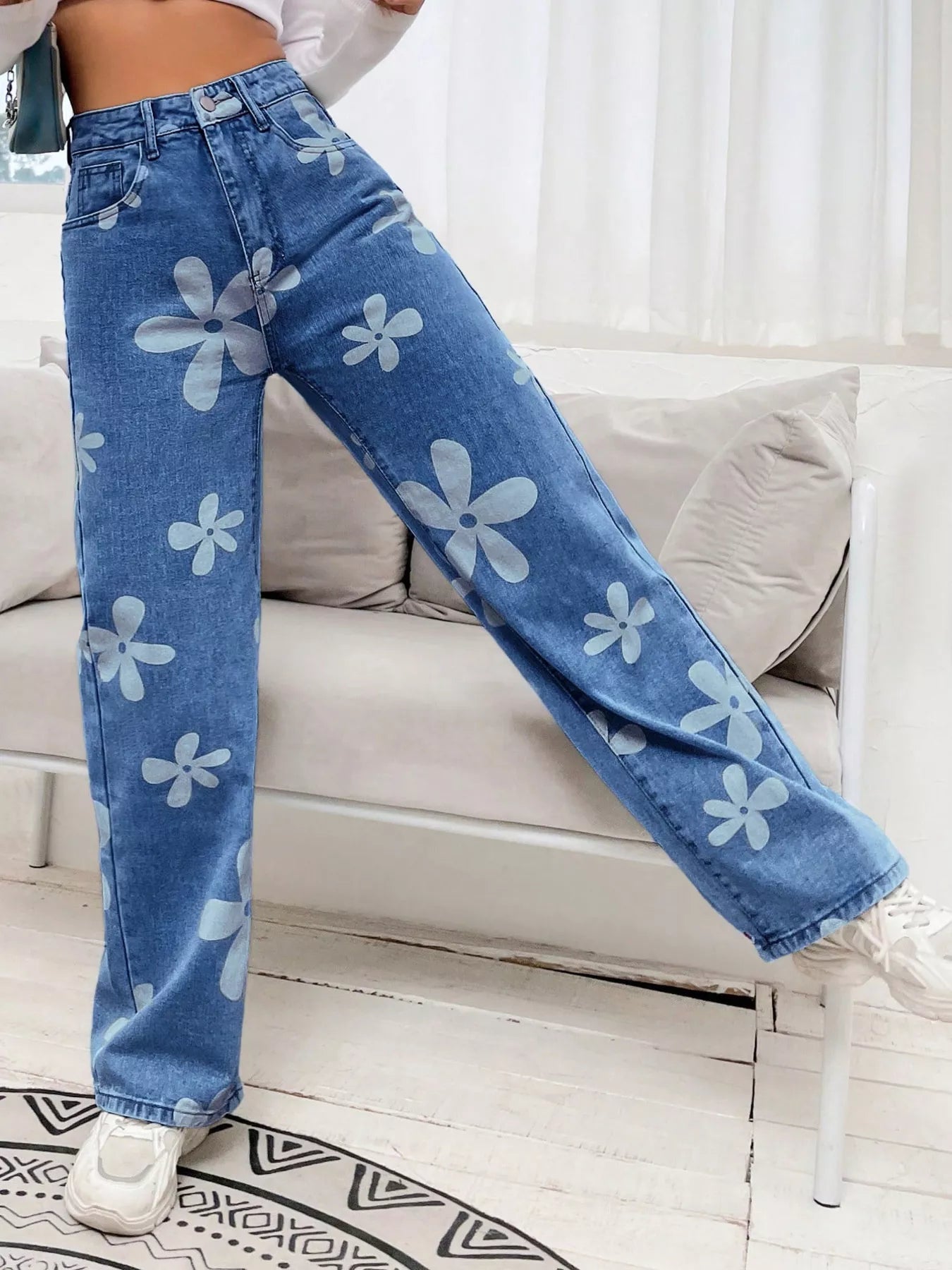 Dark blue floral wide leg denim jeans front view on model