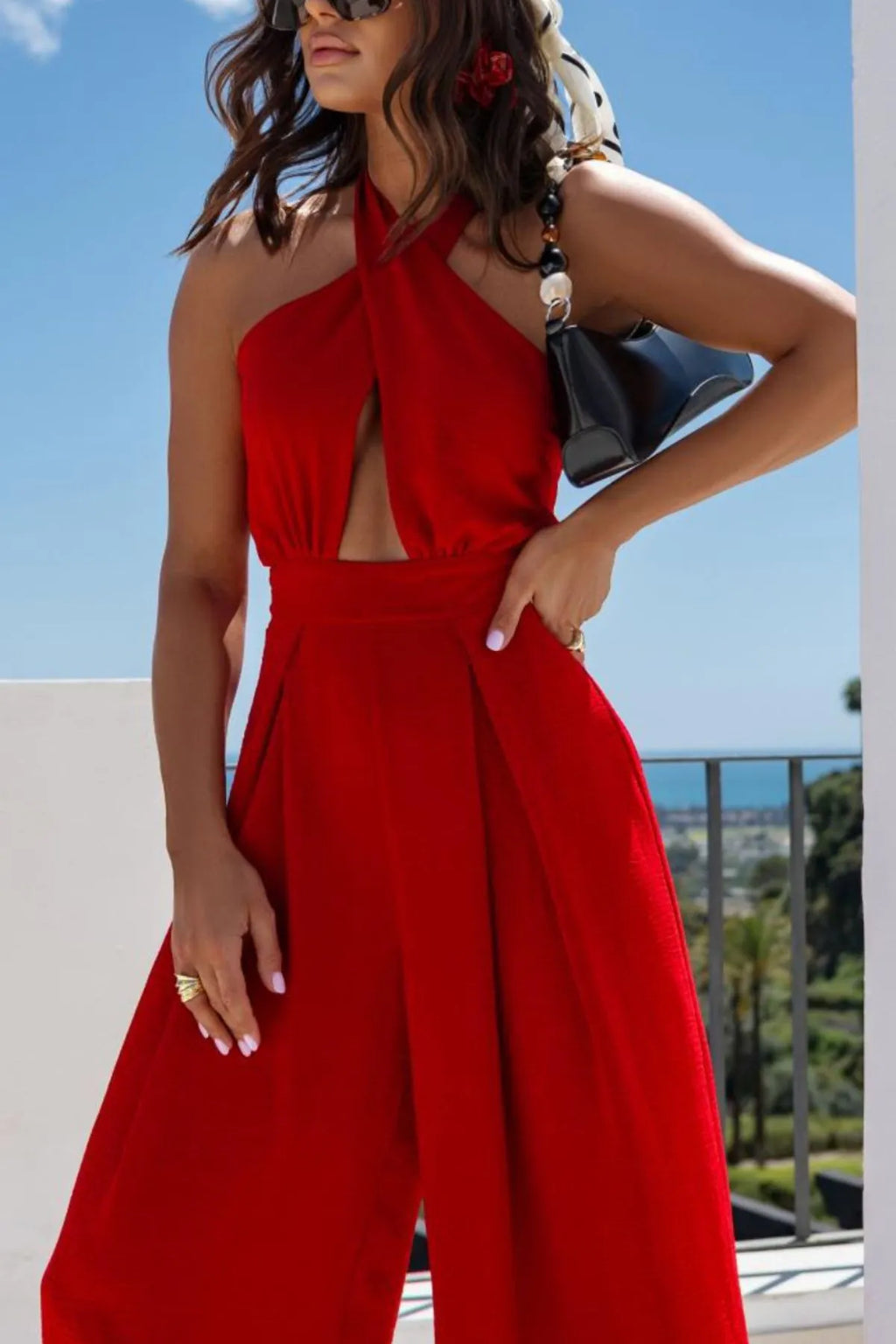 Red backless jumpsuit crisscross back detail
