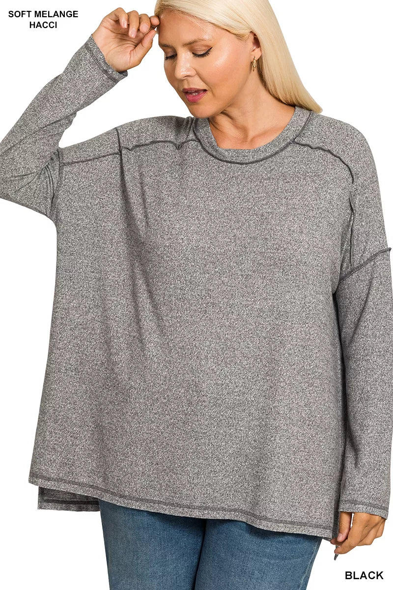 Exposed seam hi low tee in black side view