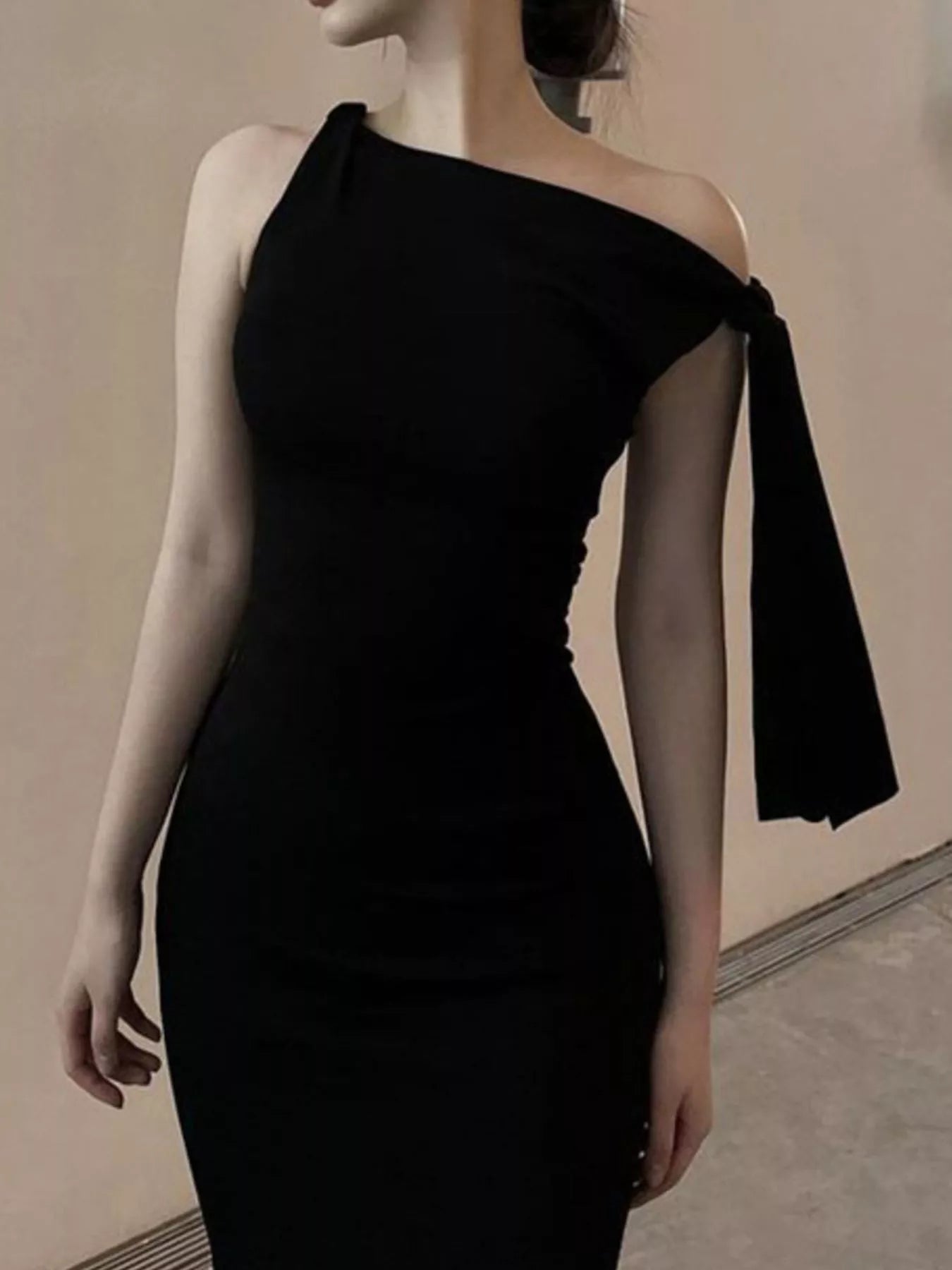 Sleeveless draped dress dinner styled look