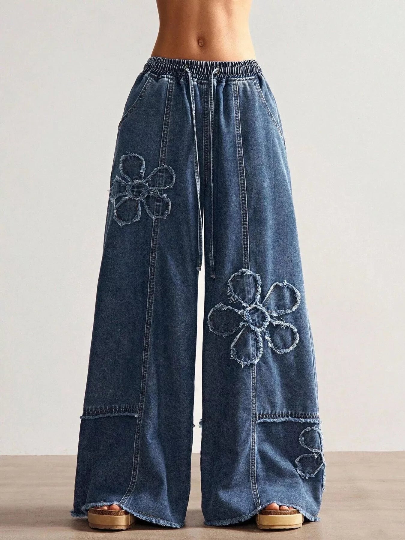 Floral applique jeans in dark blue full view