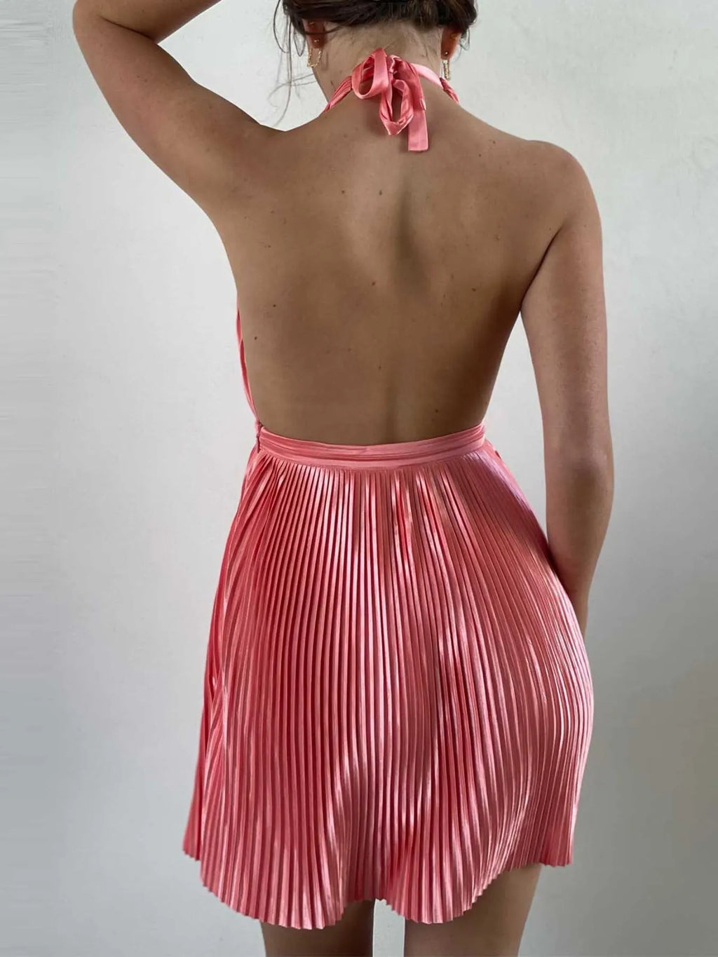 Pleated halter mini dress close up of pleats