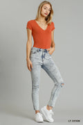 Distressed stretch denim skinny jeans light wash front view