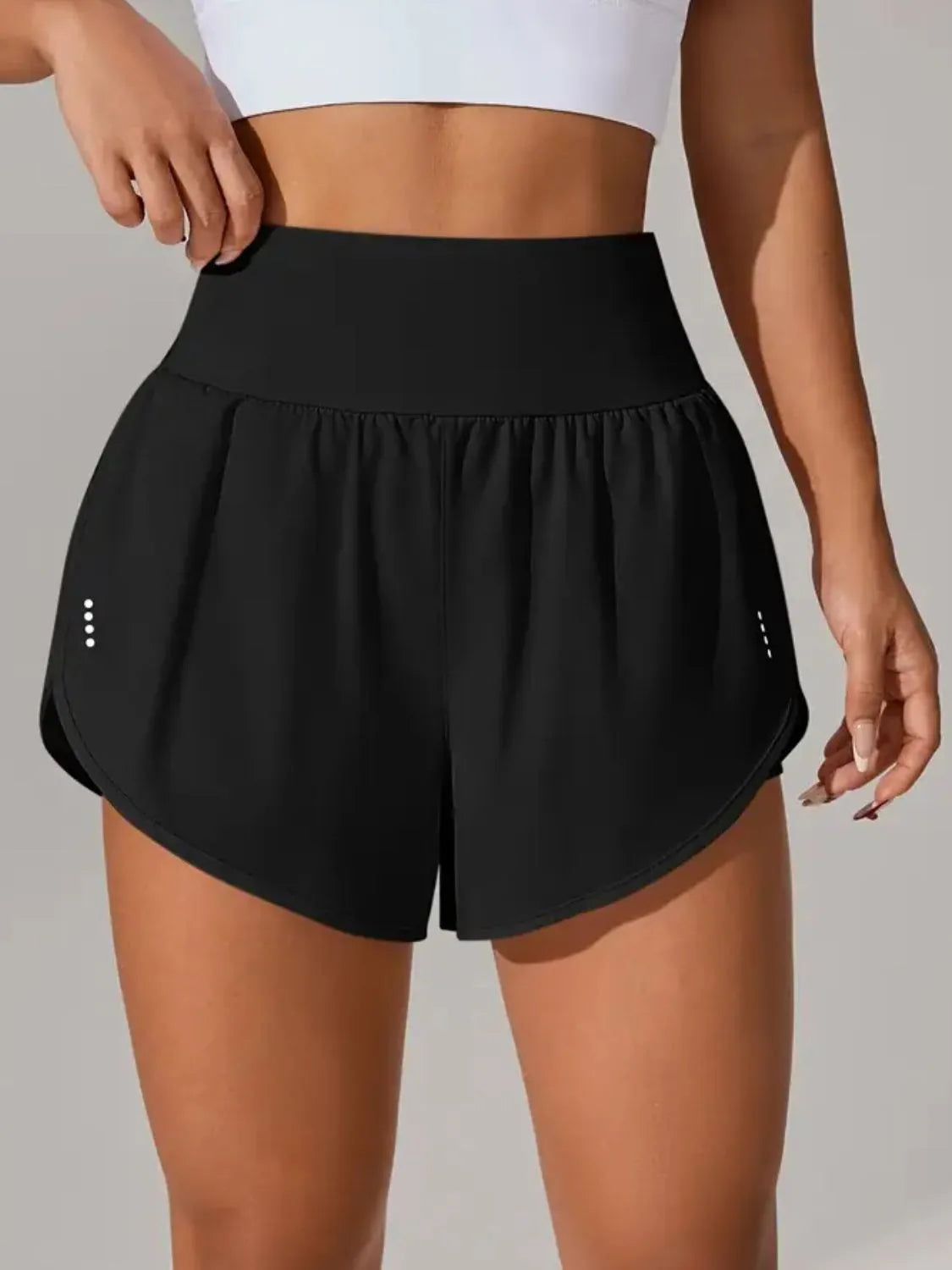 Neon green active shorts front view on model