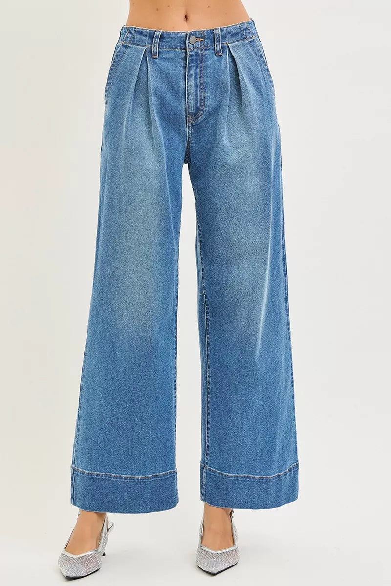 Woman wearing RISEN slouchy pleated jeans
