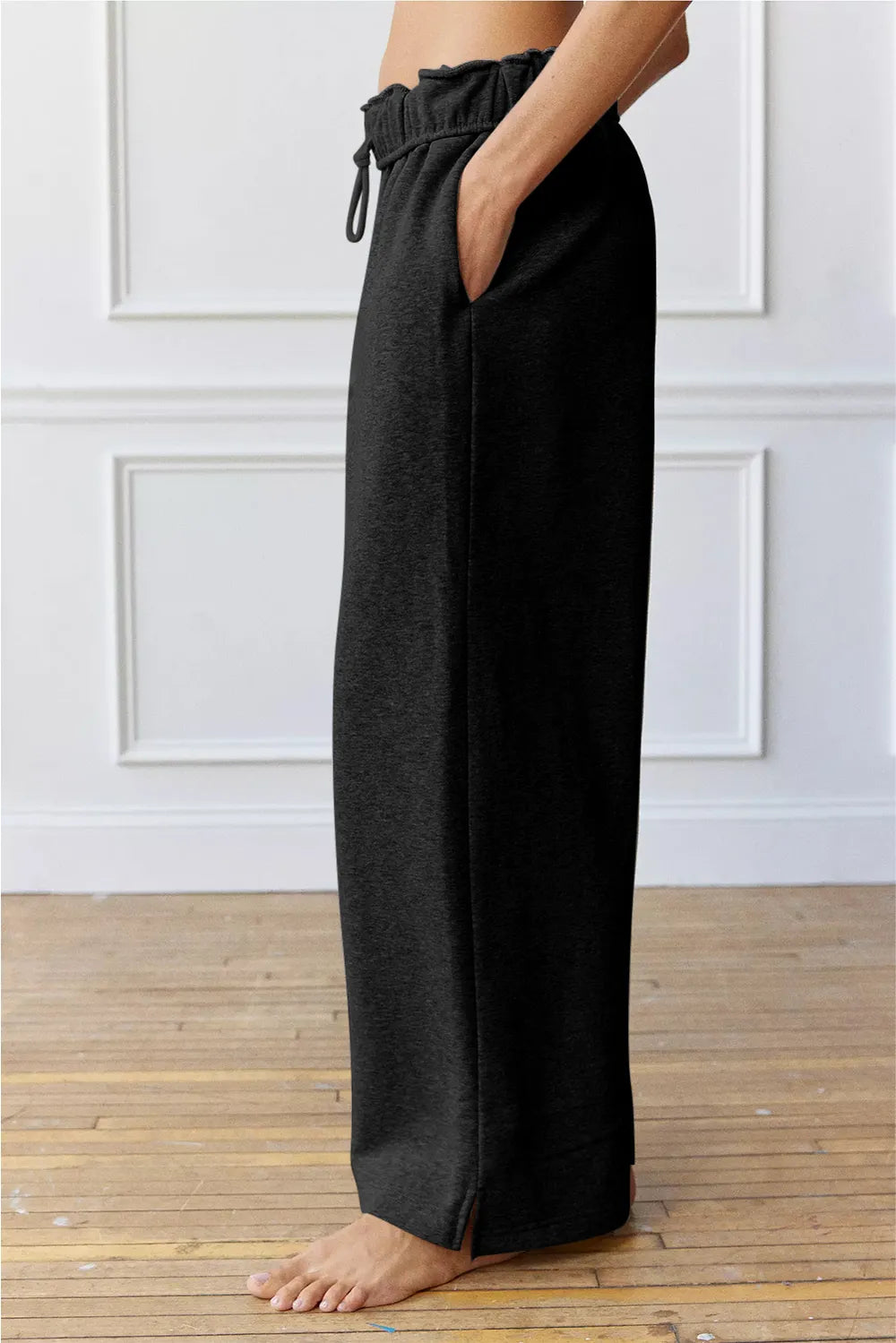 Black wide leg pants back view on model