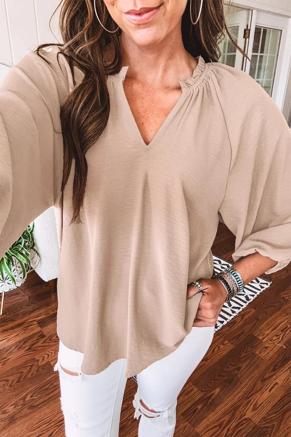 Three quarter sleeve blouse side view on model