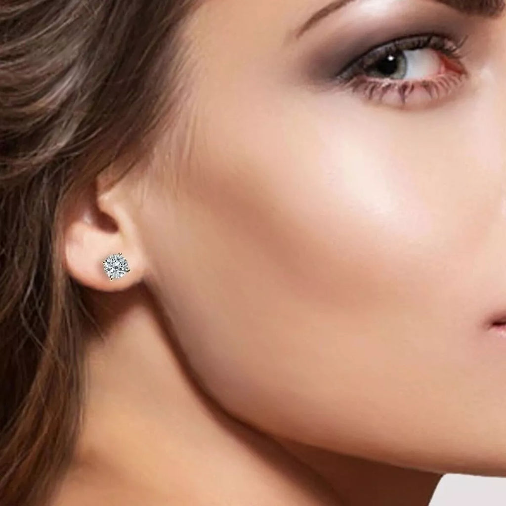 Moissanite stud earrings worn on model ear