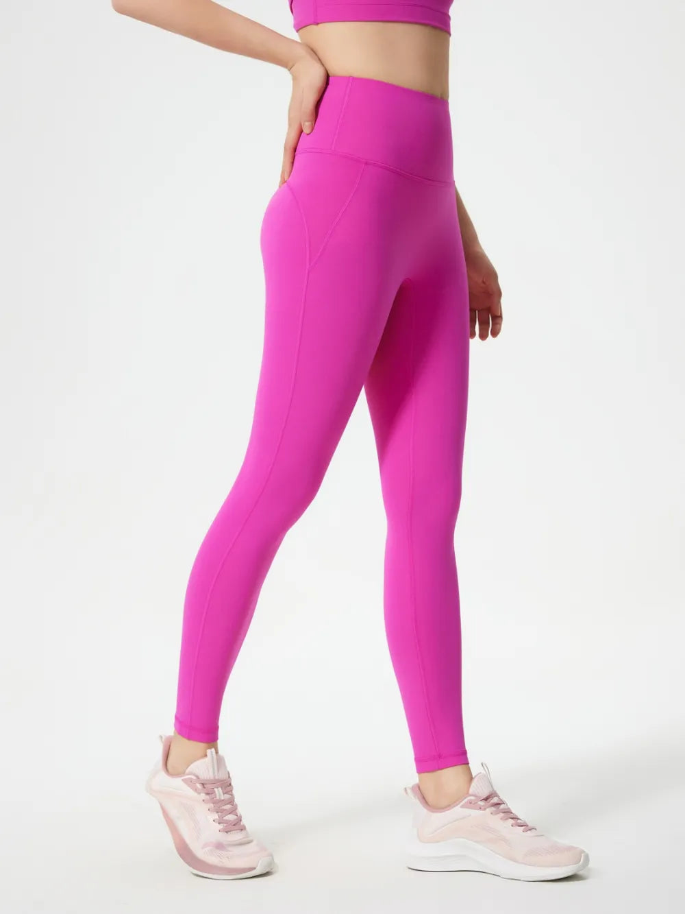 Fuchsia pink active leggings on model