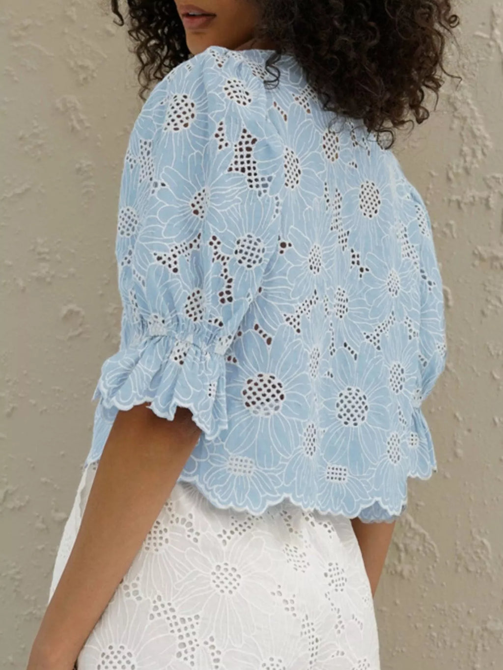 Embroidered blouse eyelet detail closeup