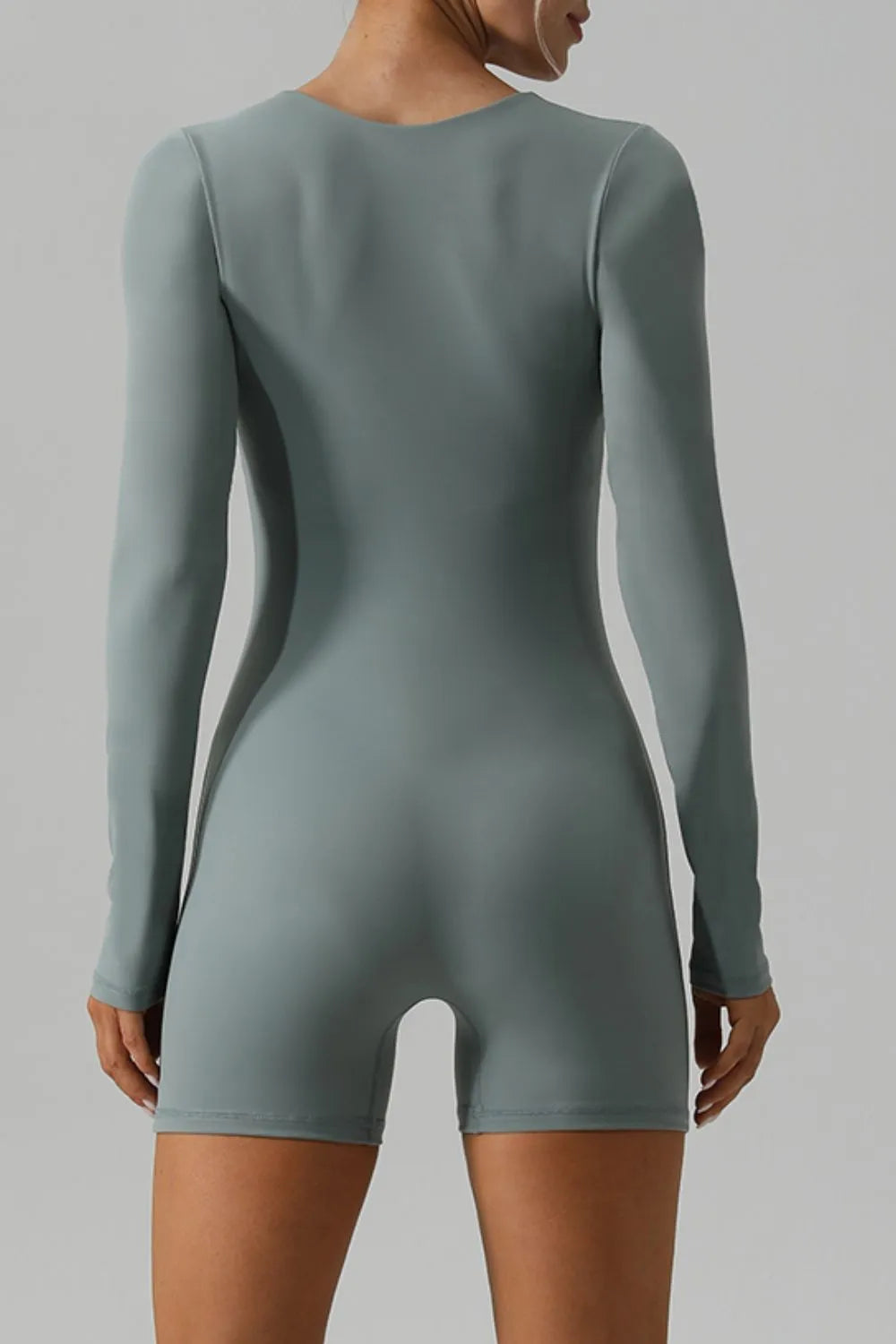 Light green long sleeve romper side view
