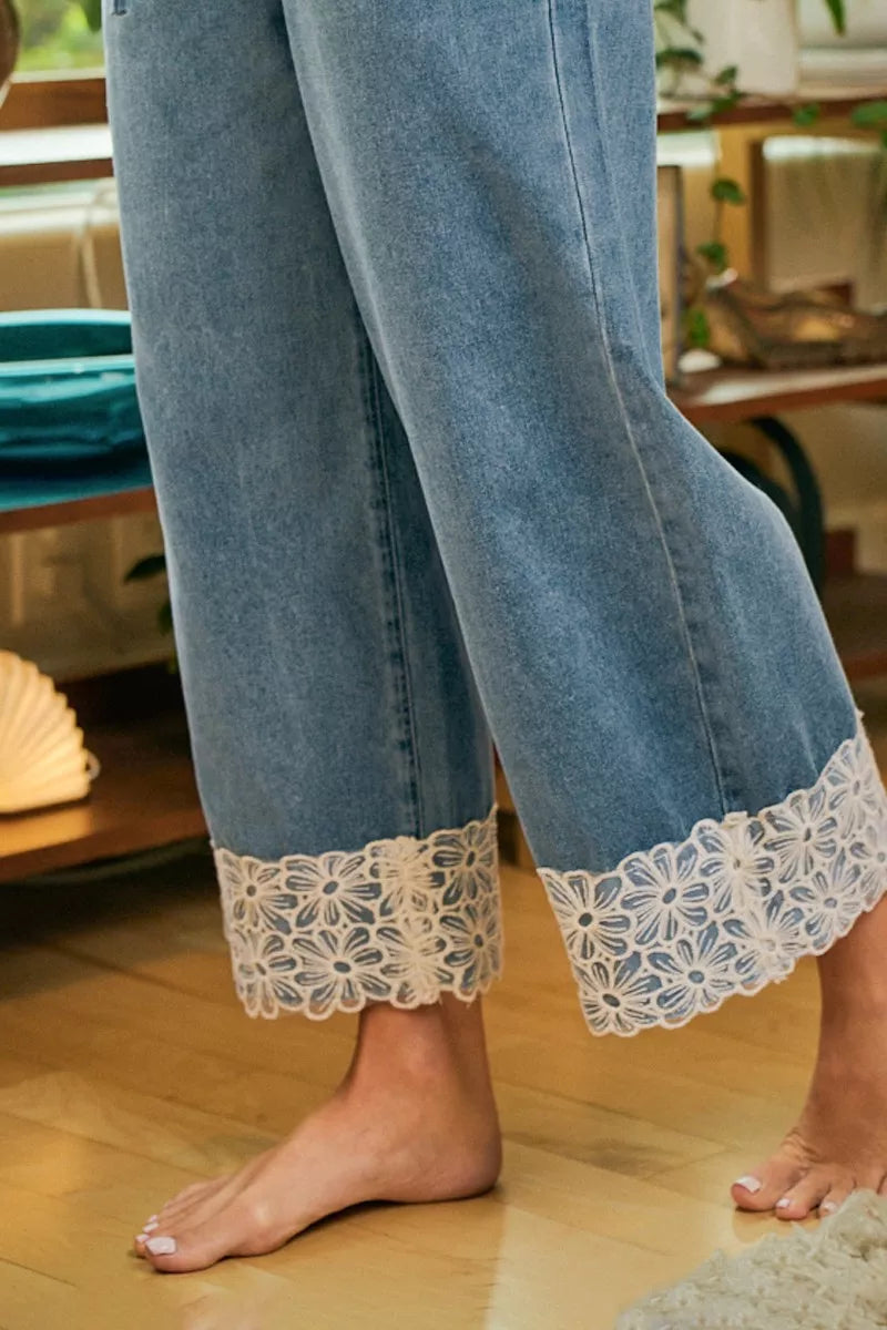 Drawstring waist detail on washed denim pants