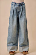 Mid rise pleated wide leg denim jeans front view on model