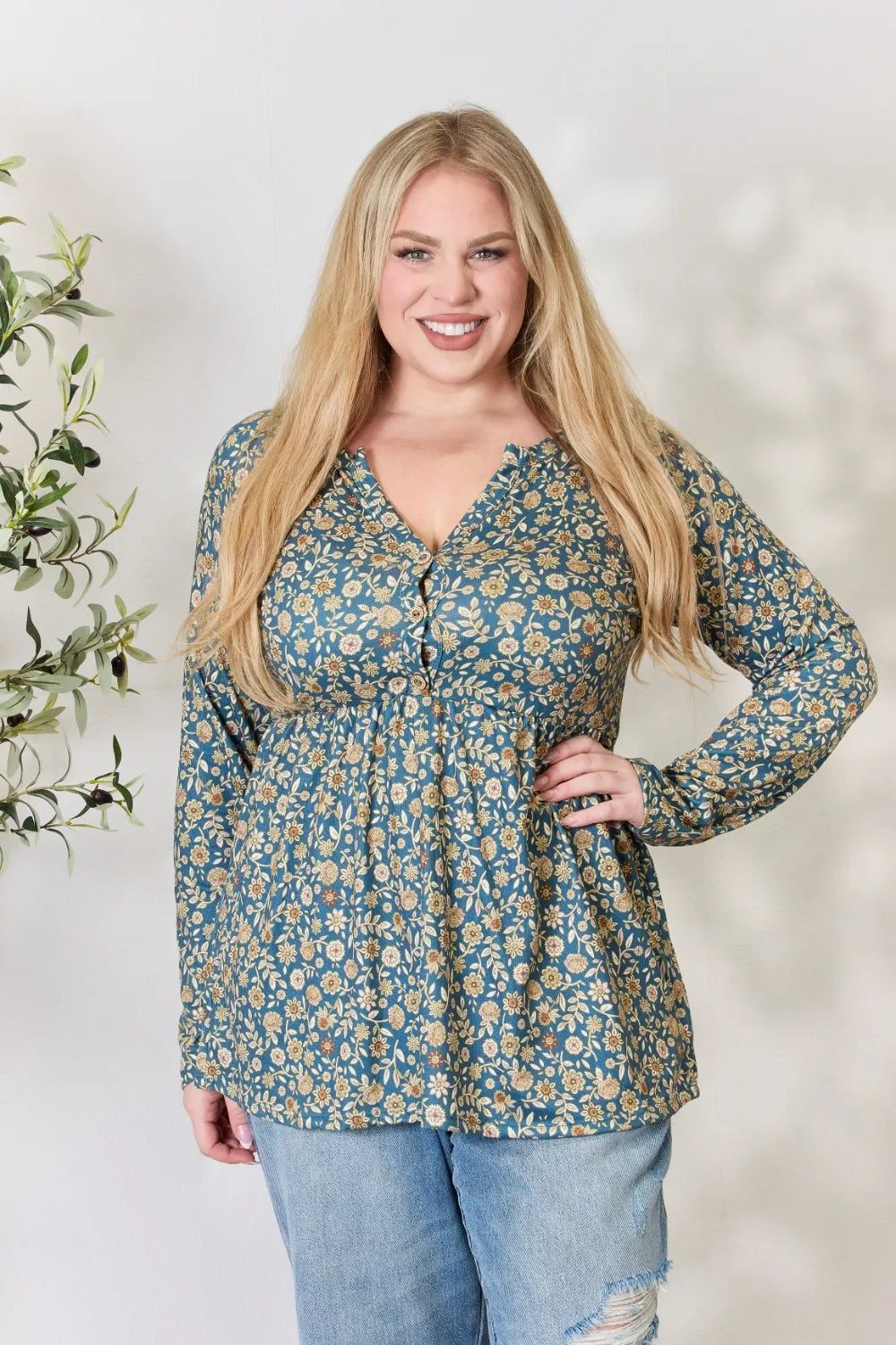 Floral long sleeve blouse styled with jeans