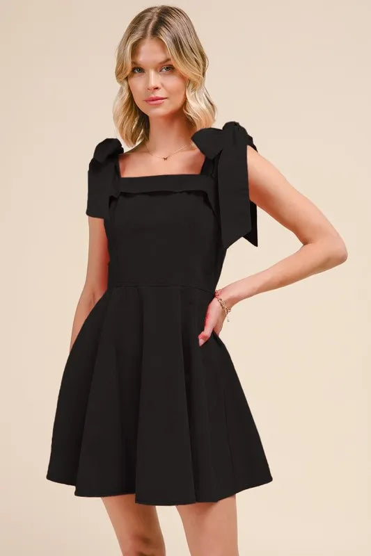 Model wearing black washed gameday dress