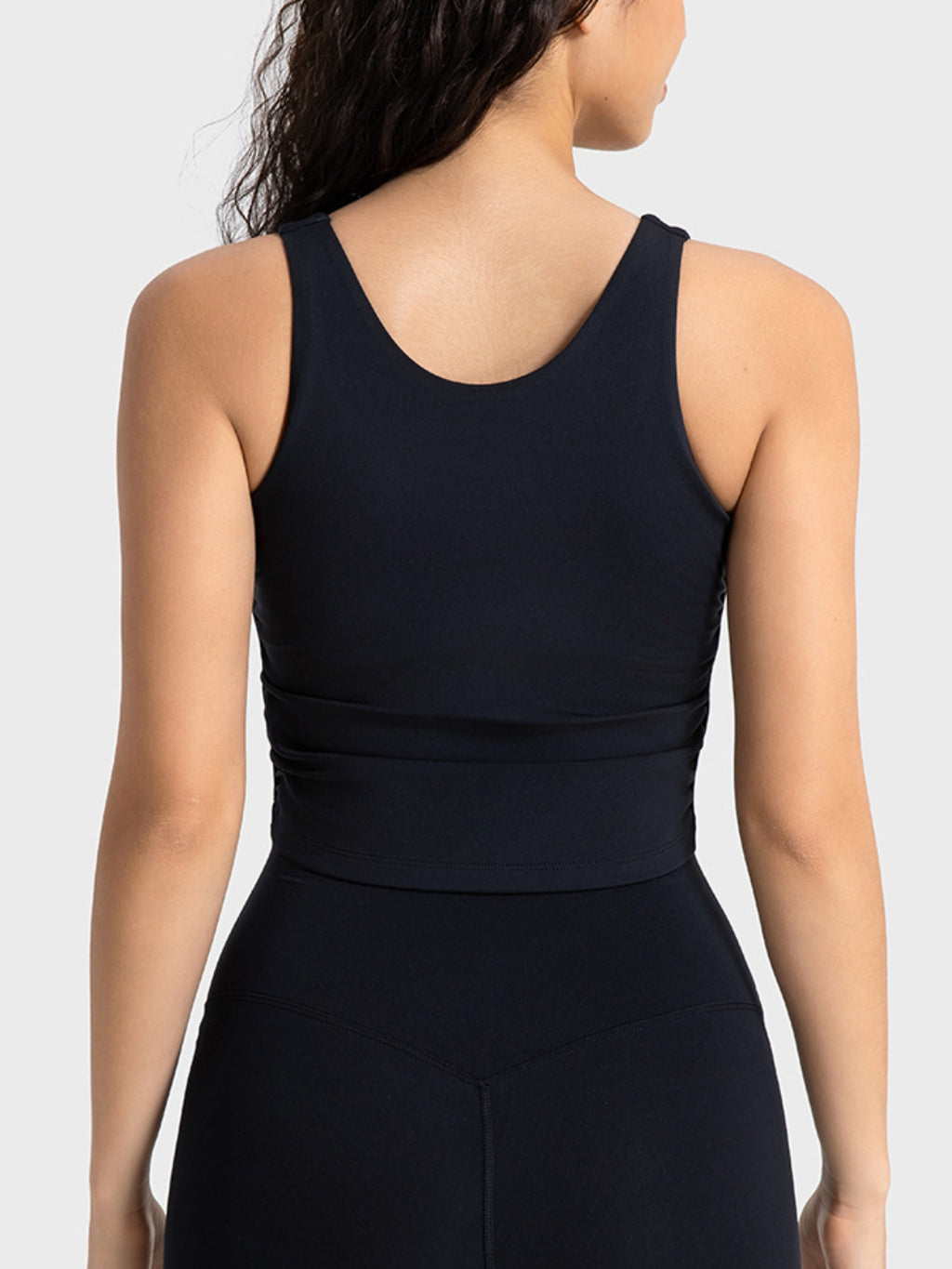 Cropped sport tank top styled with leggings