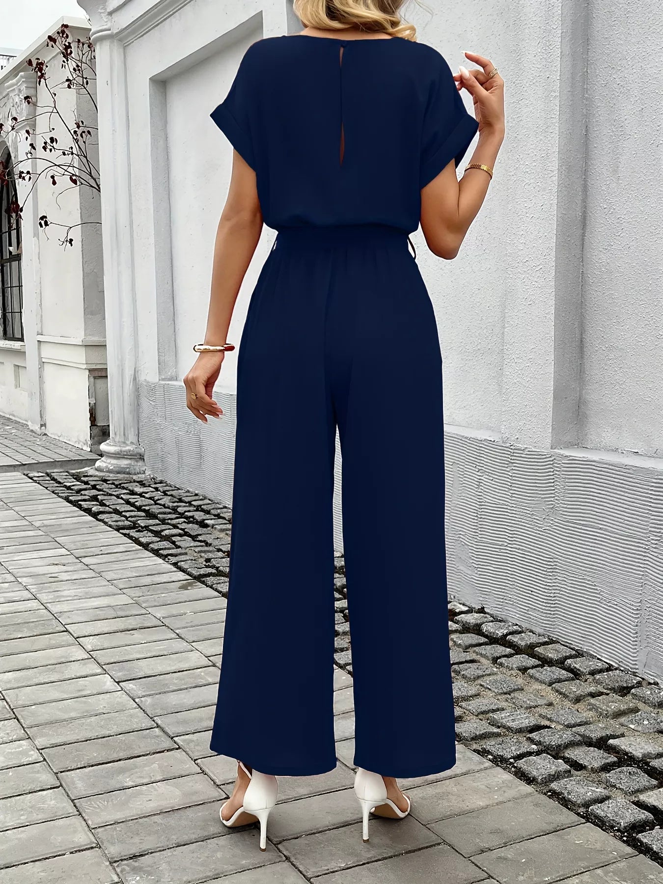 Wide leg jumpsuit in orange red on model