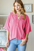 Ribbed half button drop shoulder top front view in hot pink