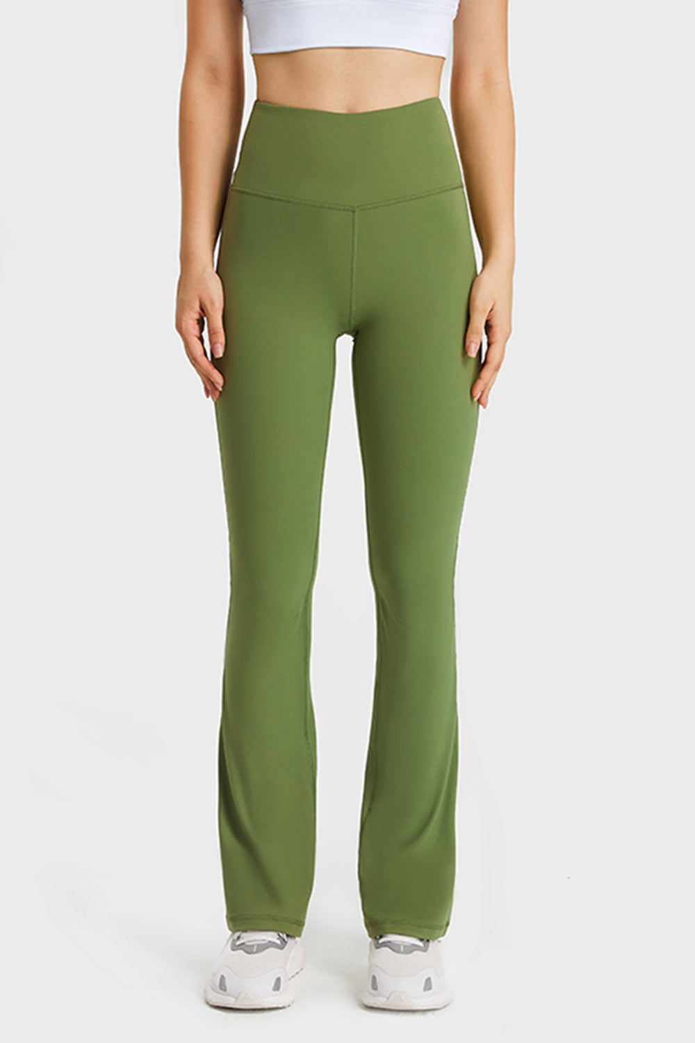 Elastic waist flare yoga pants front view in green