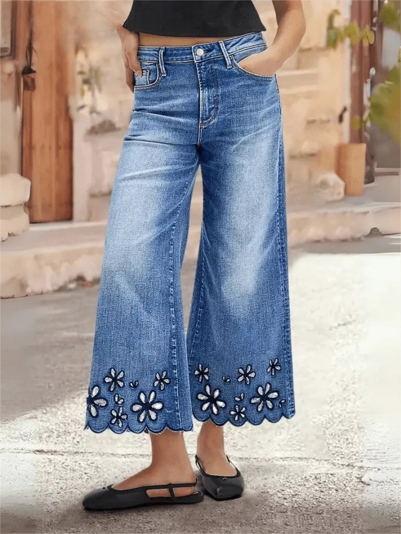 Blue embroidered wide leg cropped jeans front view on model