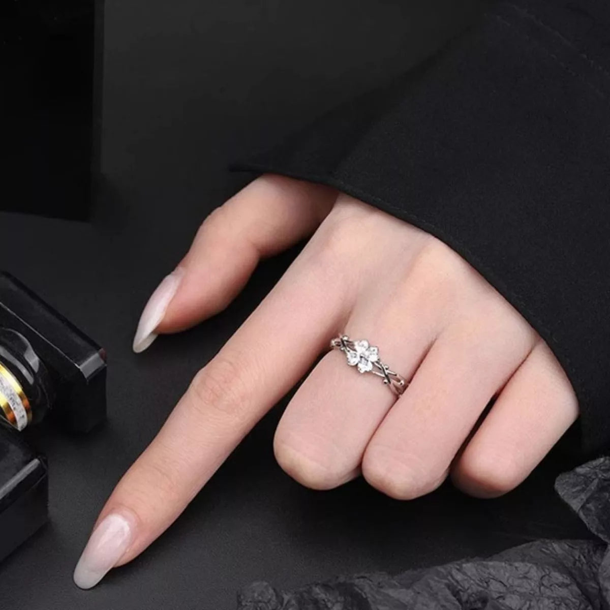 Adjustable zircon silver ring on hand