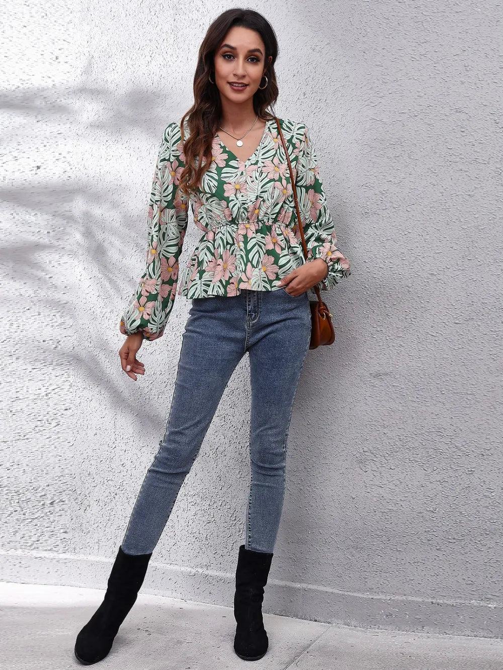 Green floral peplum blouse styled on model