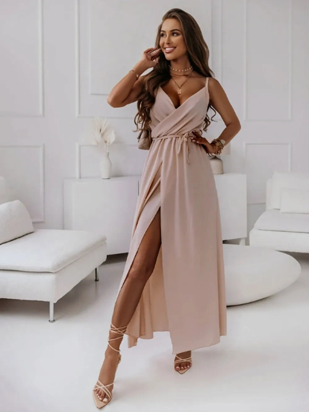 Blush sleeveless midi dress back view on model
