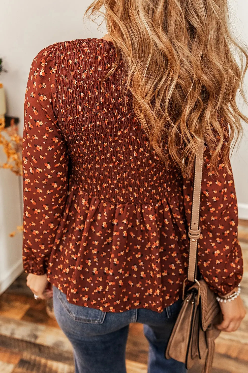 Floral smocked blouse ruffle hem detail