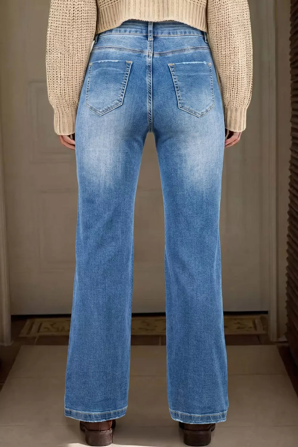Side view of dusty blue acid wash jeans full length