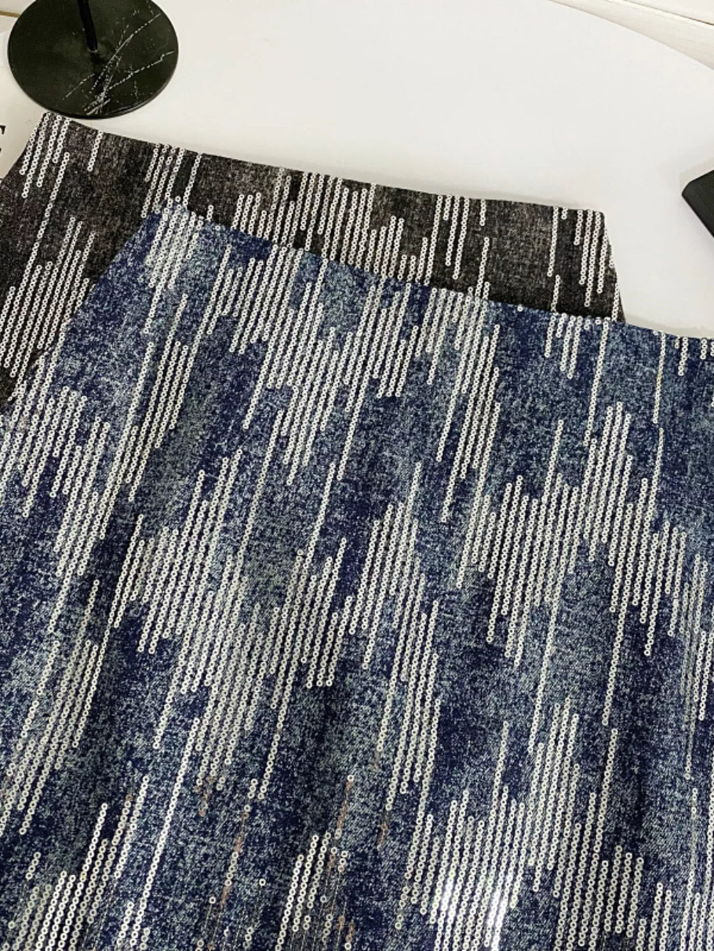 Glitter mini skirt waist detail