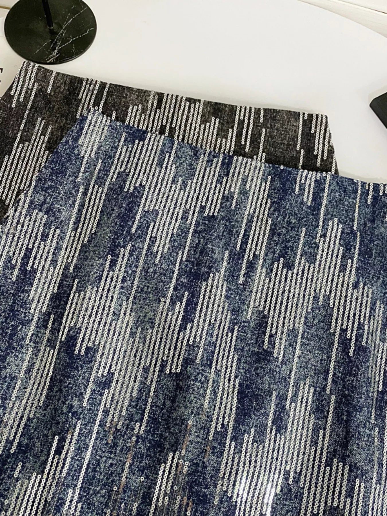 Glitter mini skirt waist detail