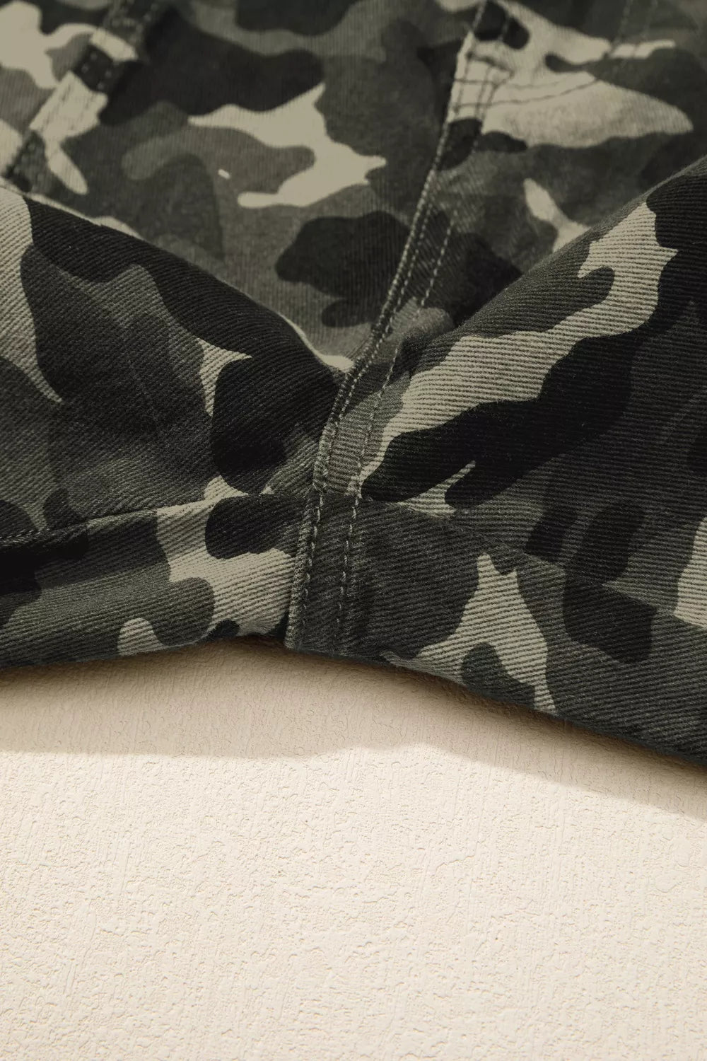 Full length view of green camo print denim pants