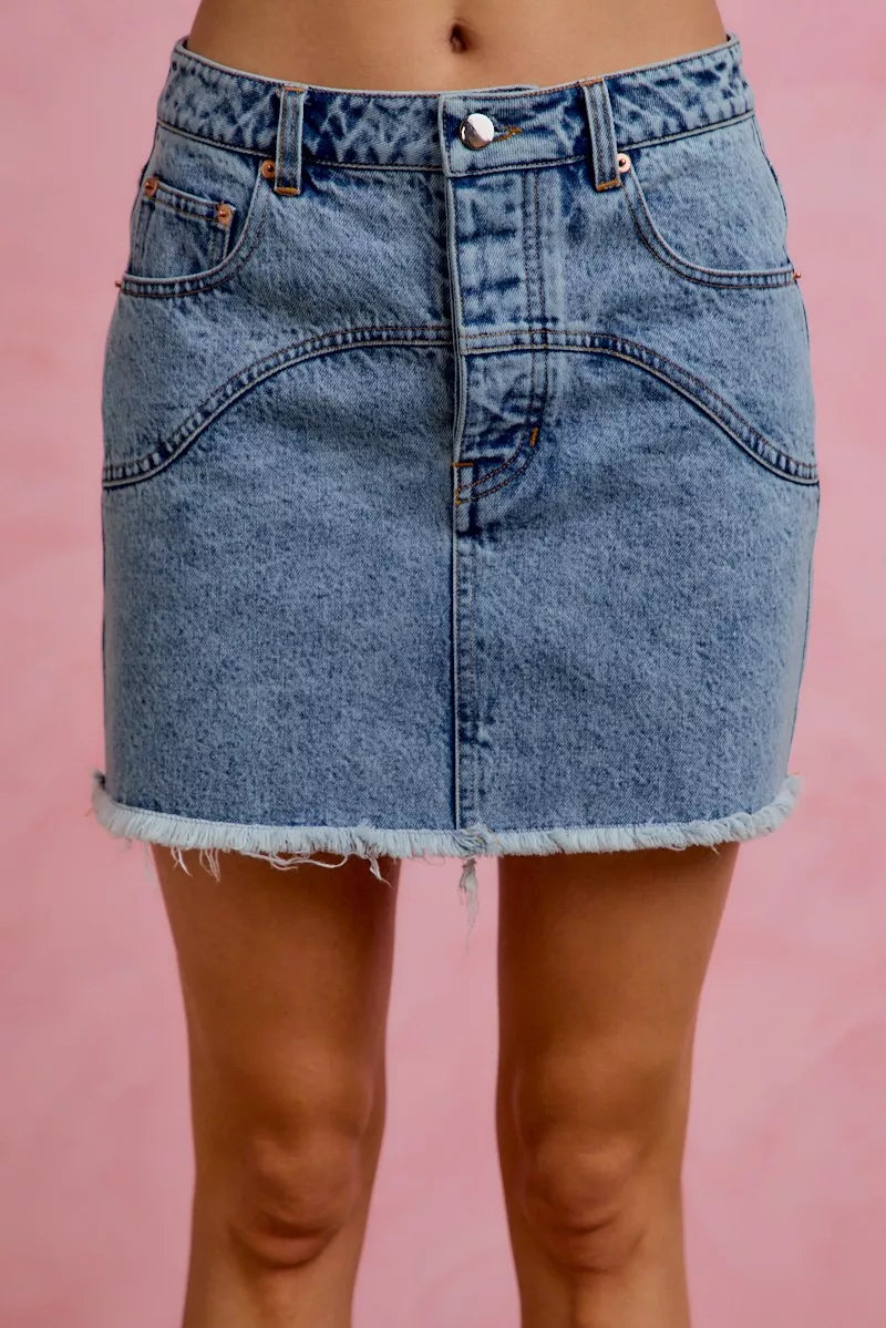 Raw hem detail on denim mini skirt