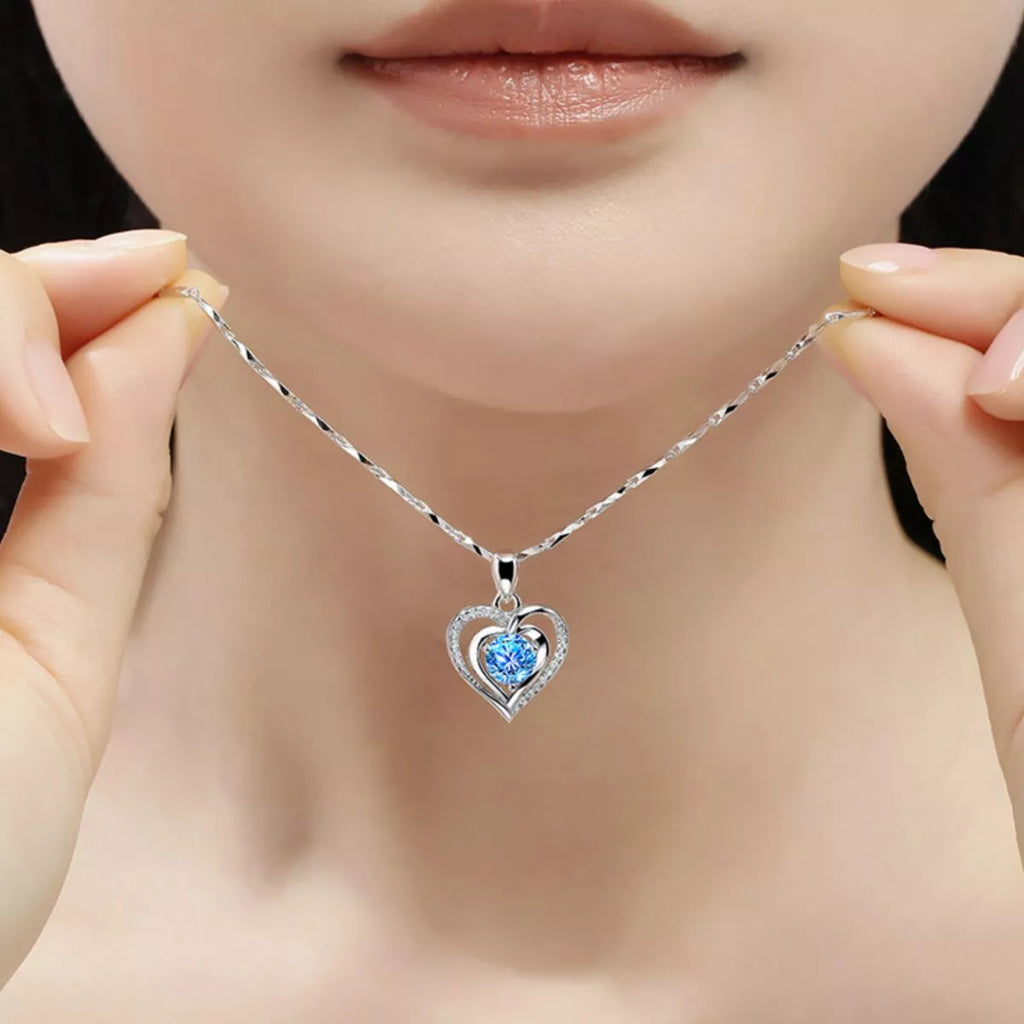 Silver heart necklace side angle view