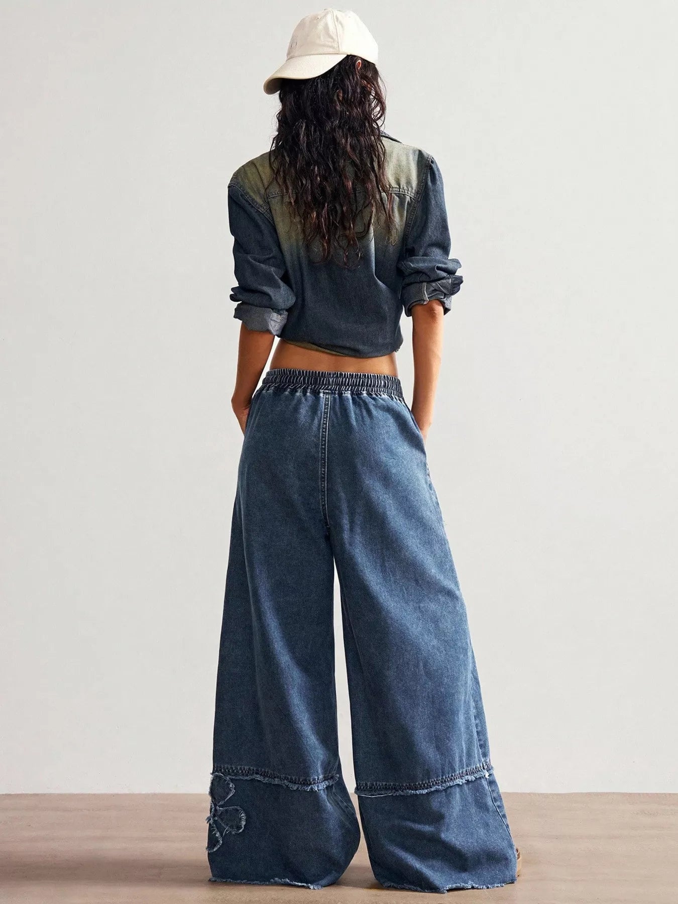 Floral applique jeans fabric detail