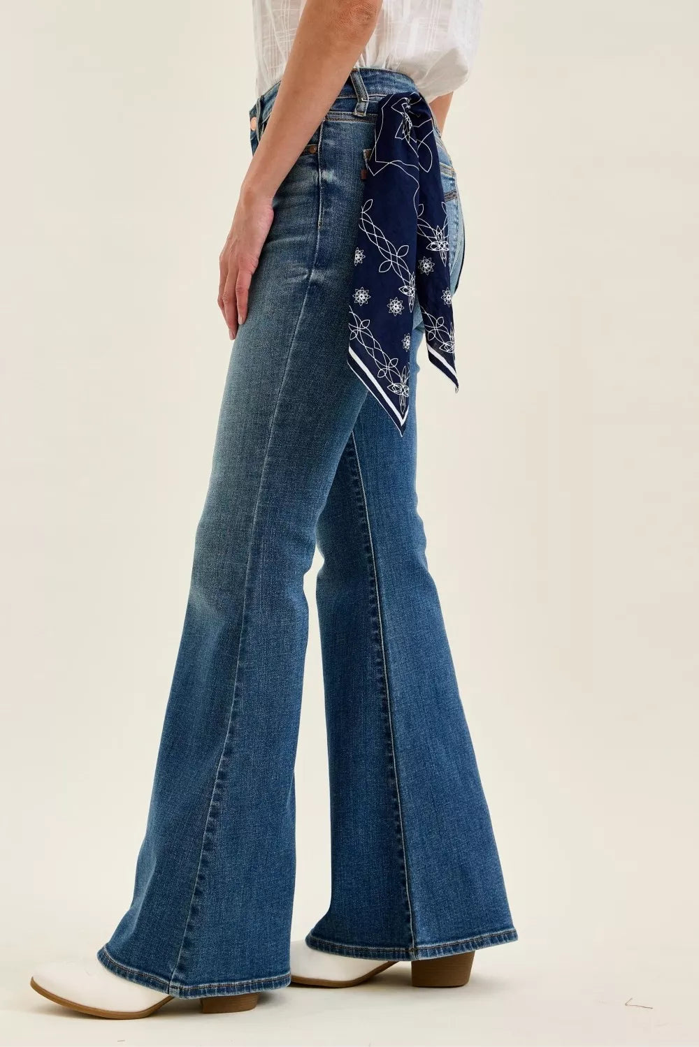 Triple needle stitched back pockets on flare jeans