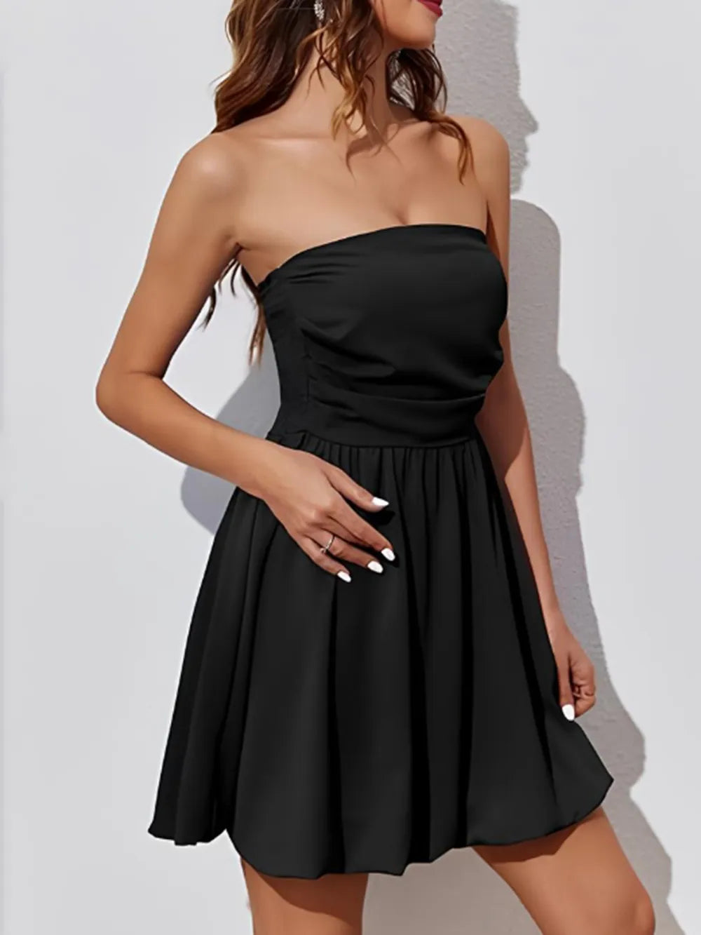 Strapless ruched mini dress side view on model