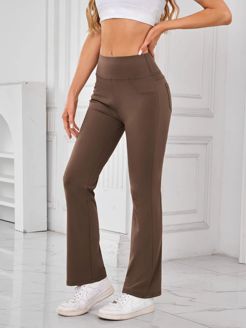 Model wearing brown active pants styled look