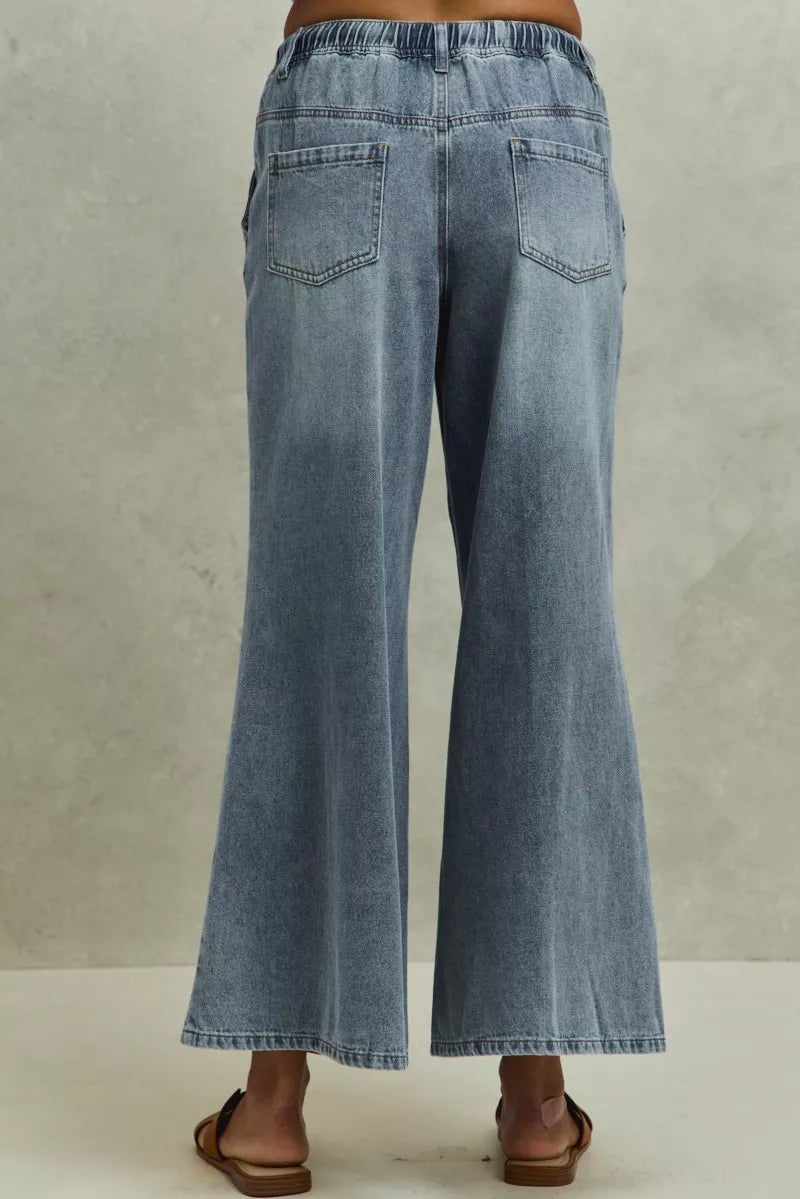 Drawstring elastic waistband detail on flare jeans