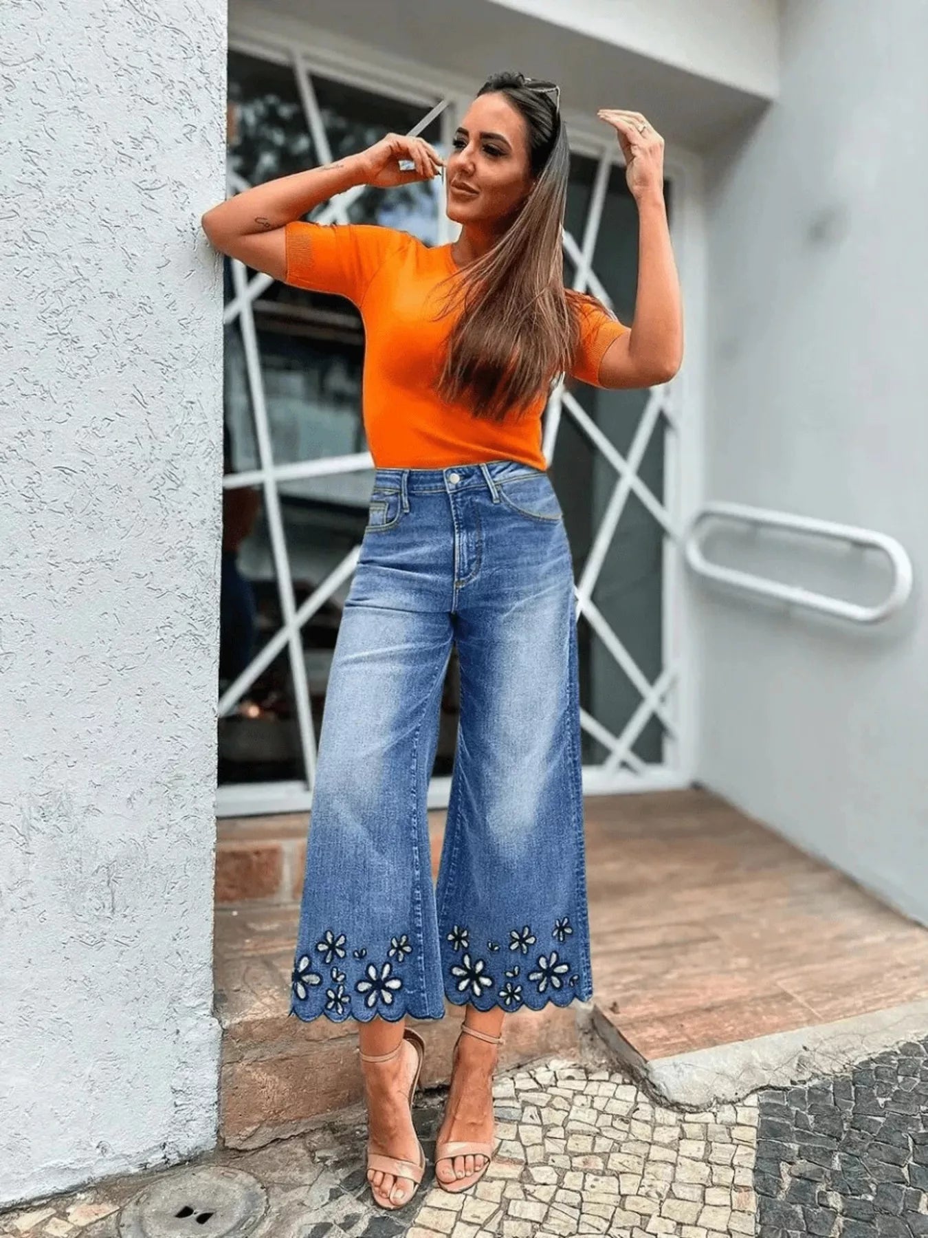 Model wearing embroidered cropped jeans styled outfit