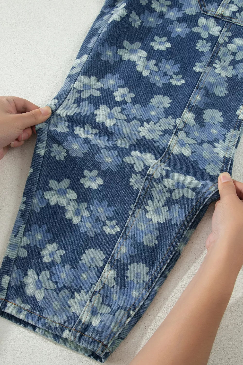 Dainty floral barrel jeans flat lay