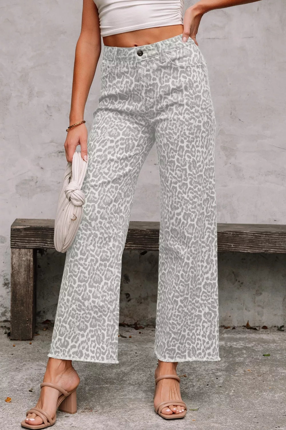 White leopard print wide leg jeans front view on model