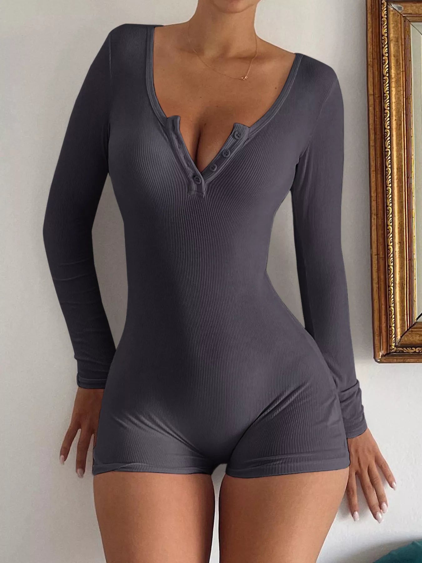 Knit long sleeve romper back view on model