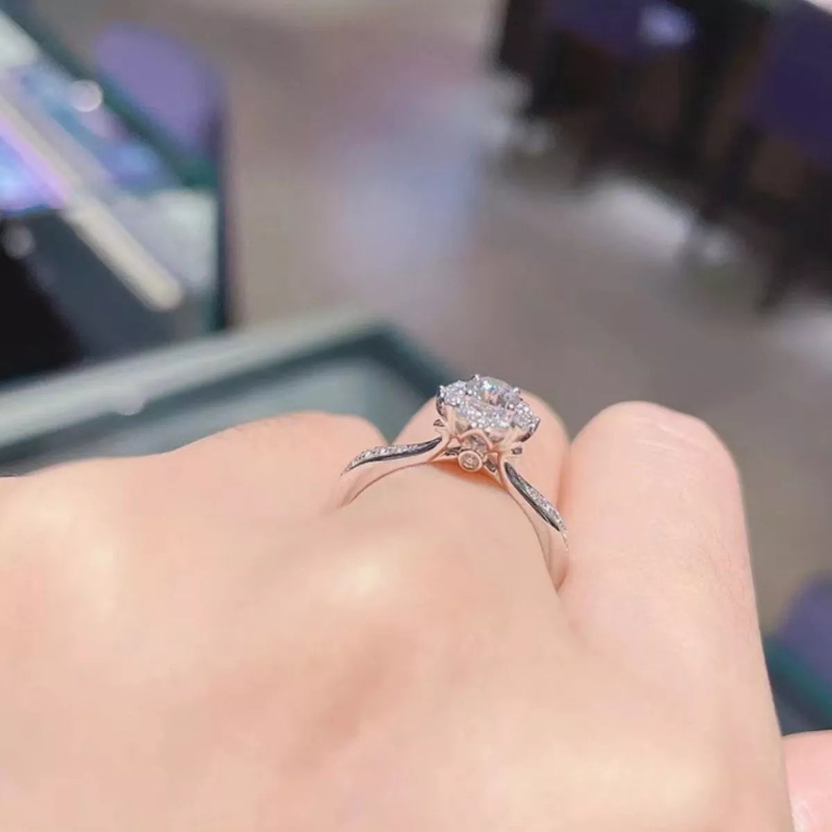 Moissanite ring shown on hand