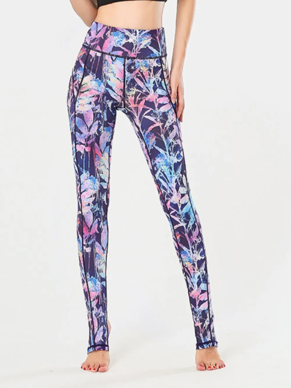 Printed wide waistband stirrup leggings styled with sneakers