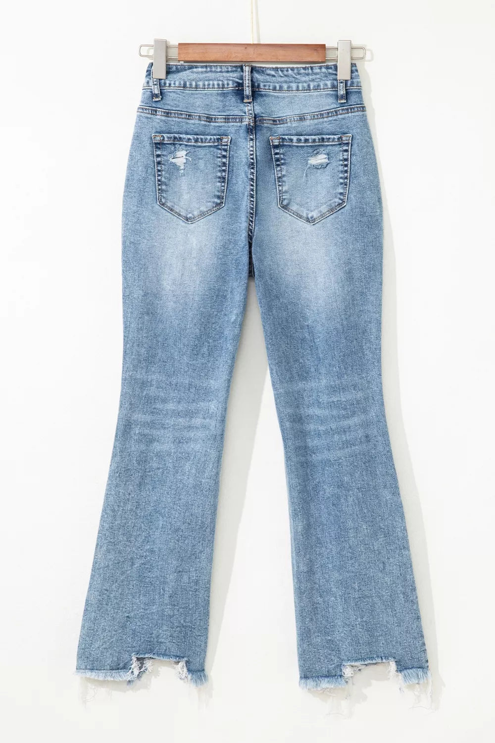 Raw hem detail on cropped flare jeans