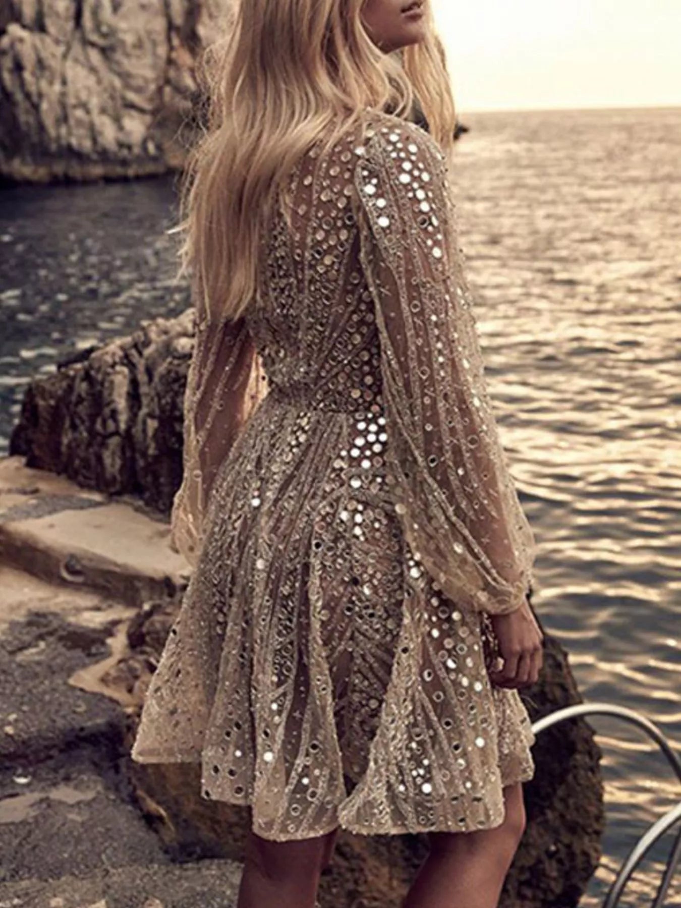 Sparkly sequin mini dress showing deep V neckline