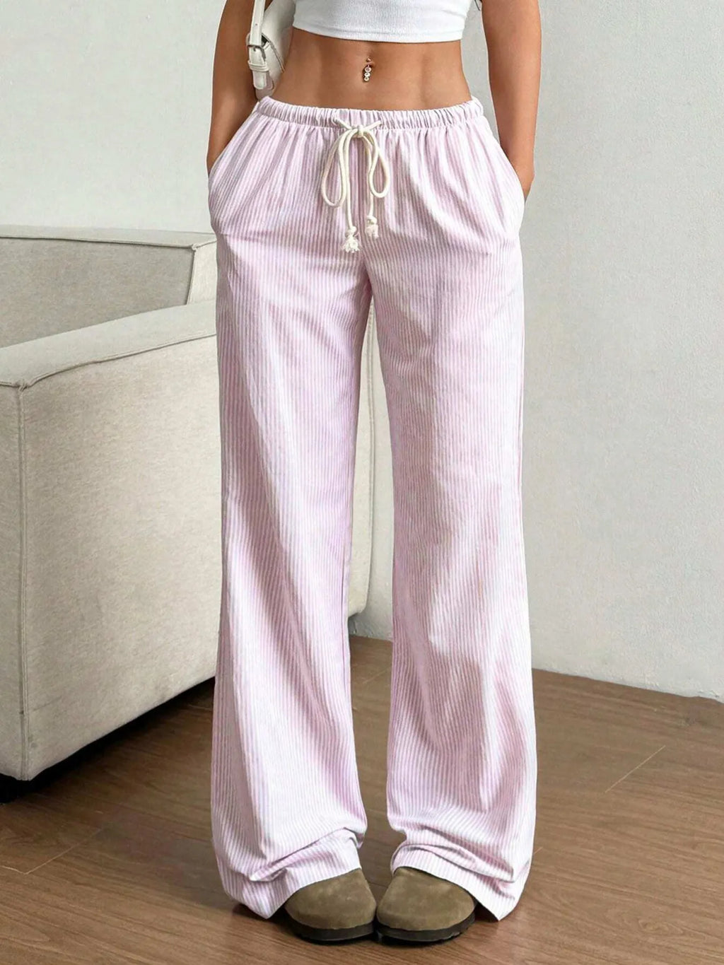 Dark pink striped pants on model