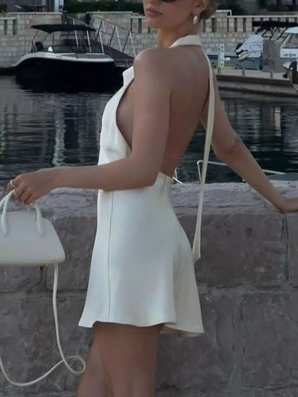 Halter neck mini dress side view showing fit