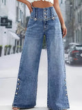 Model wearing high waist button detail wide leg jeans casual look